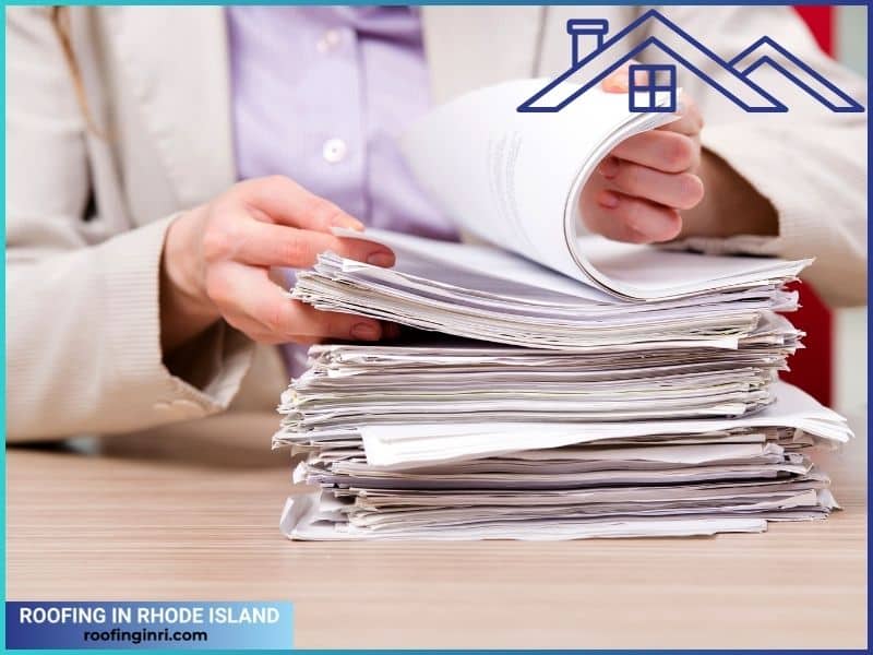 Businesswoman Working with Stack of Papers