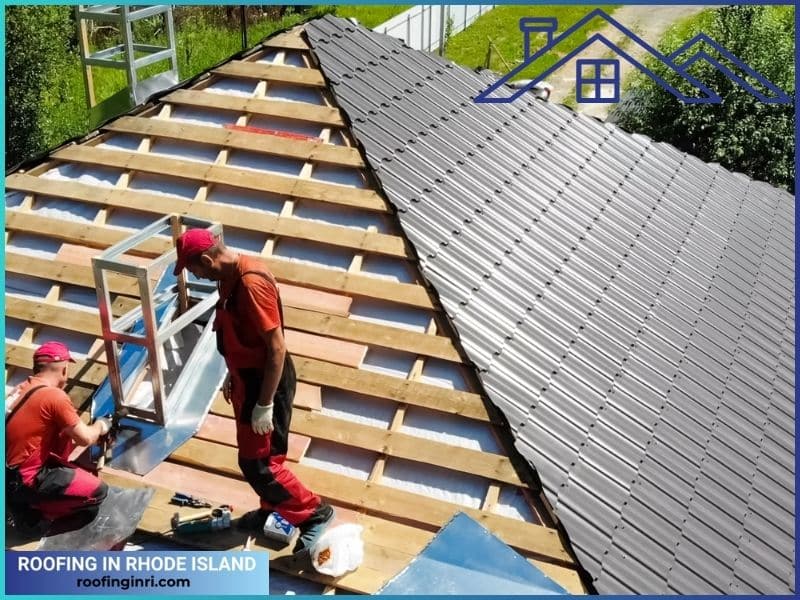 Workers Installing Roofing Material