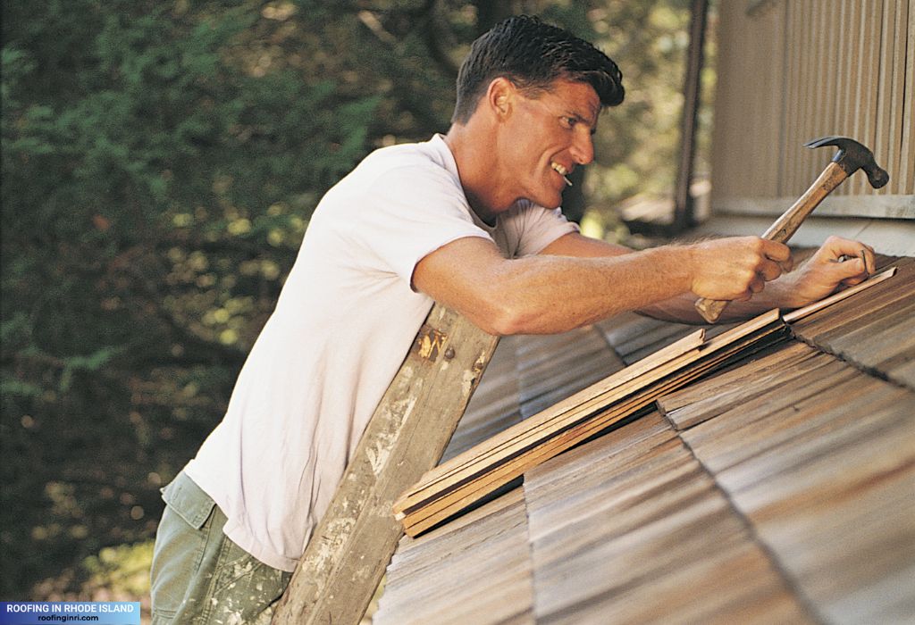 Man fixing a roof, Handyman repairing a roof