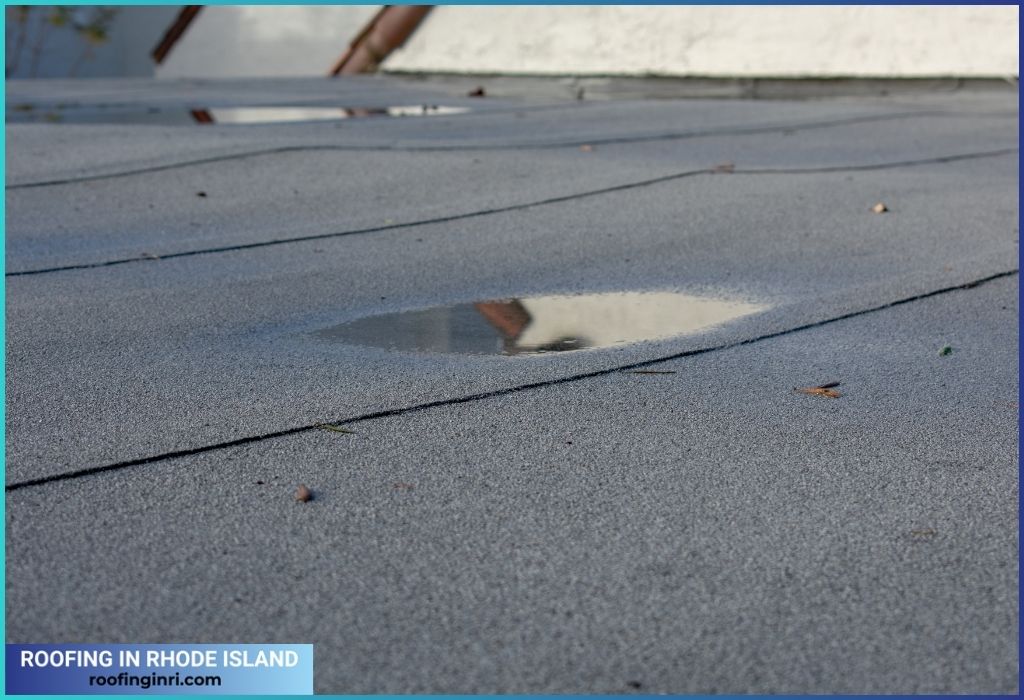 Ponding rainwater on a flat roof after rain