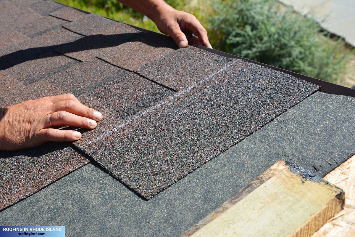 Asphalt Shingles Installation. Roofer Contractor Installing Asphalt Shingles on House Roofing Construction